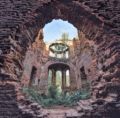 From within, illustration of a semi-ruined building reborn of vegetation, with an open roof, in a blue sky, without clouds

