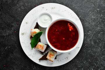 Beet soup. Ukrainian traditional borscht with lard and croutons. Top view. Free space for text.