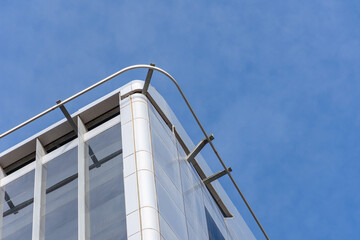 Low-angle view of Park Mall Hotel and Conference Center building against a blue sky.