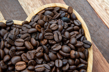 coffee beans in heart-shaped tra,y representing love of coffee