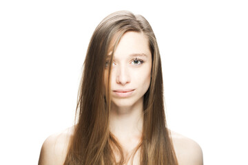 Fototapeta premium Studio portrait of a beautiful brunette girl with positive face expression looking at camera...
