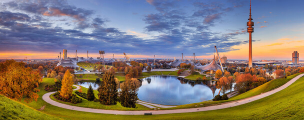 Autumn cityscape, panorama, banner - view of the Olympiapark or Olympic Park located in the Oberwiesenfeld neighborhood of Munich, Bavaria, Germany - obrazy, fototapety, plakaty