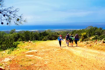 Gordijnen Mediterranean landscape - view of tourist mountain trail with hikers on Akamas peninsula, island of Cyprus, Republic of Cyprus © rustamank