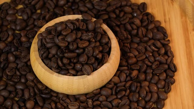 Coffee beans. Beans in wooden container.
 Free space for text. Footage for 
product advertising. Studio light.  Coffee time. 
