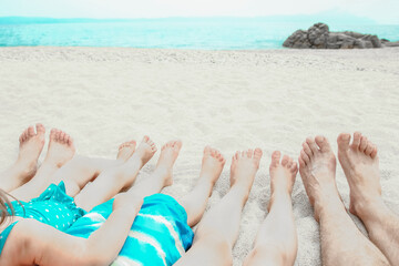 beautiful legs in the sand of the sea greece background