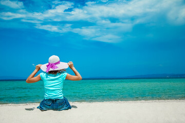 Fototapeta na wymiar happy girl at sea in greece on sand nature