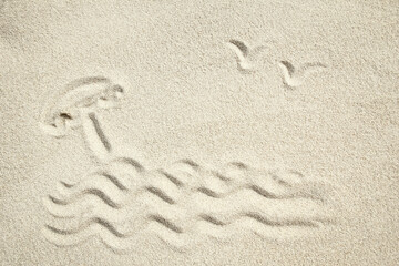 A drawing on the sand by the sea travel background