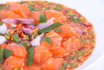 Spicy Salmon Salad on the white dish.