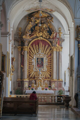 Magnificent opulent splendid Bavarian baroque church cathedral basilica interiors with stucco, murals, altar, Pilars, ceiling paintings, gold, wood domes nave	