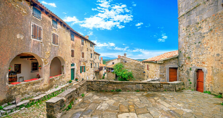 Cityscape with ancient houses and courtyard in smallest Hum town. Istria, Croatia