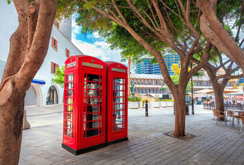Two British red telephone boxes on main street at downtown. Gibraltar, Europe