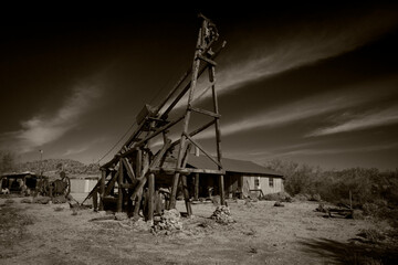 A sepia picture of an old abandoned mine
