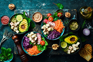 Healthy vegetarian eating, super food. The concept of healthy eating. On a black stone background. Top view.