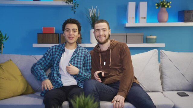 Brother and younger brother are at home watching indecent +18 scenes secretly from their parents.
Excited teenage brothers watch hidden inappropriate video at home from their parents.
