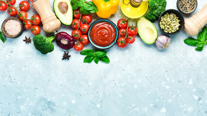 Food background. Fresh vegetables on a gray stone background. Top view. Free space for text.