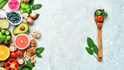 Fresh tasty ingredients for healthy cooking or salad preparation on a rustic background, top view,...