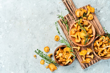 Cooking. Chanterelle mushrooms on the kitchen table are ready to be cooked. Top view. Free space...