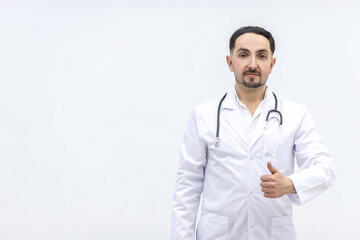 Photo of male mature doctor posing at camera with a stethoscope.