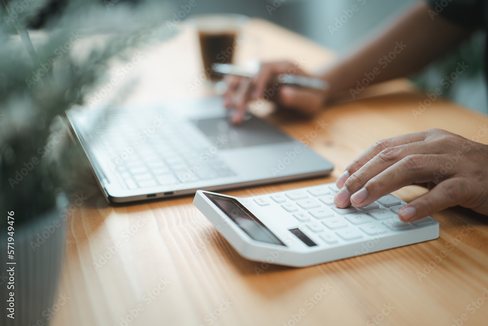 Poster Hands of an accountant using a calculator to calculate a tax refund