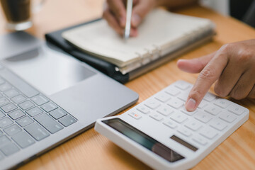 A close-up of a businessman, accountant, or banker making calculations Accounting Banking Business Financing