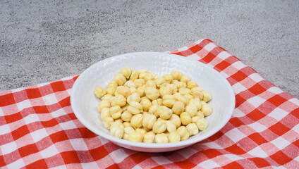 Cooked Chickpeas on white bowl. Chickpeas is nutritious food. Healthy and vegetarian food.