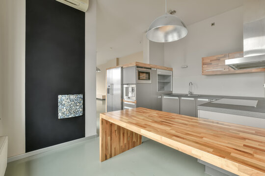 Stylish kitchen with wooden table