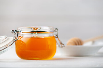 Fresh fragrant honey in a jar close-up
