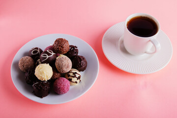 photo lots of chocolates and a cup of coffee