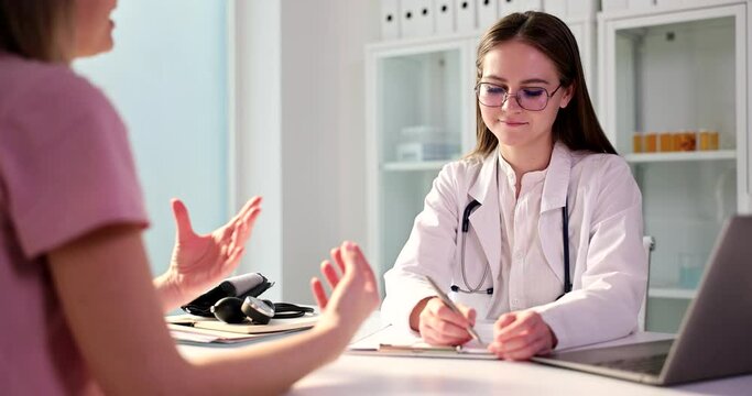 Doctor student intern communicates with patient in clinic