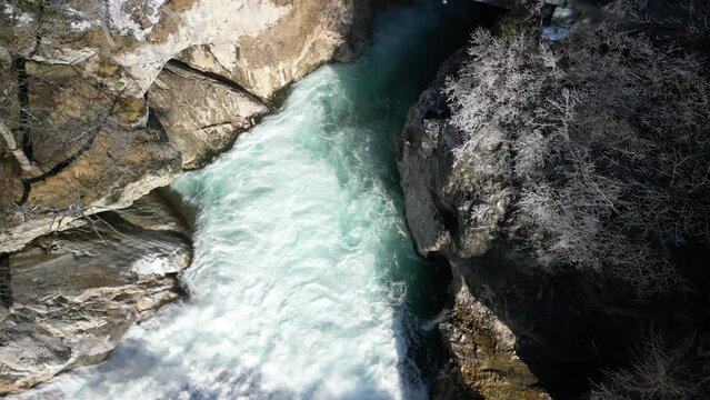 the lech fall near f&uuml;ssen in bavaria in the alps where a lot of water flows into the valley and the water flows back and forth between the rock walls recorded with a drone