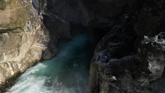 the lech fall near f&uuml;ssen in bavaria in the alps where a lot of water flows into the valley and the water flows back and forth between the rock walls recorded with a drone