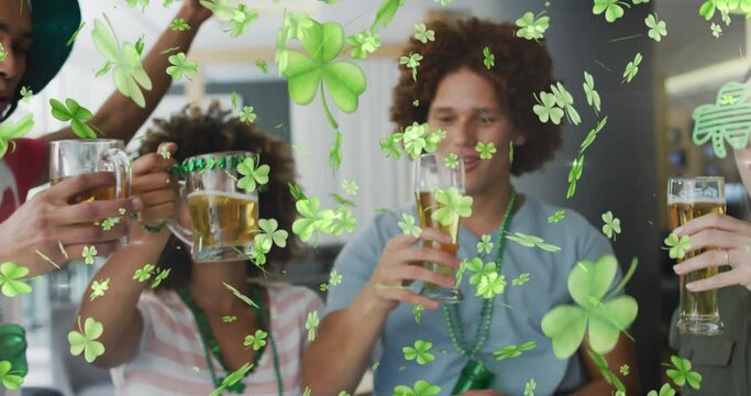 Animation of clover icons over diverse friends drinking beer