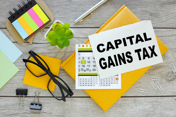 Capital gains tax cgt concept. multicolored stickers and yellow notepad with notepad page with text