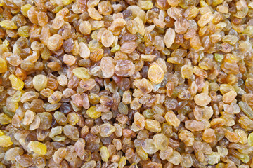 Stack of organic dried golden raisins on a market stall