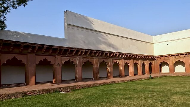 Beautiful and green clean area in front of arched colonnade at Agra Fort, Agra