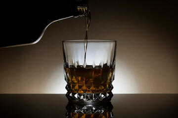 Backlit glass of whiskey