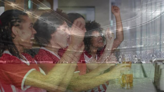 Animation of sports stadium over diverse friends in football shirts making toast in bar