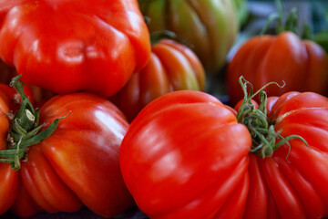 Stack of Beefsteak tomatoes on a market stall