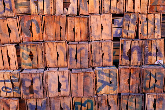 Pile of old numbered wooden crates