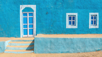 Aswan, Egypt; February 15, 2023 - Colourful Nubian houses in Aswan, Egypt