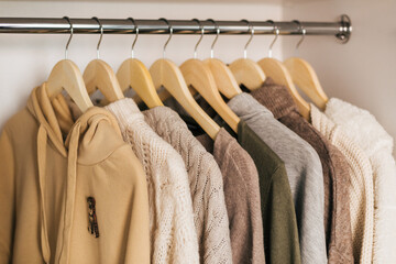 The basic wardrobe of a fashion stylist. Neutral colors: white, brown, beige, grey. White wardrobe,...