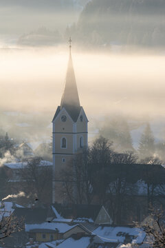 Church in windischgarsten with sun lights and fog