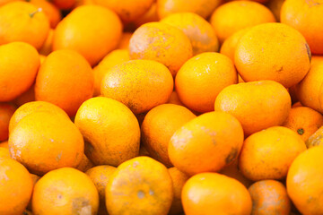Stack of clementines on a market stall