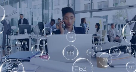 Animation of 6g text over diverse business people working at office - Powered by Adobe