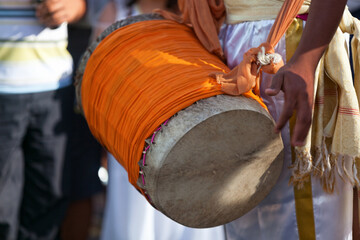 Fototapeta premium Percussionist playing with a dhol during the carnival of Grand Boucan