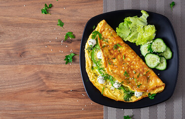 Omelette with mozzarella cheese and avocado. Ketogenic, keto diet breakfast. Top view, copy space