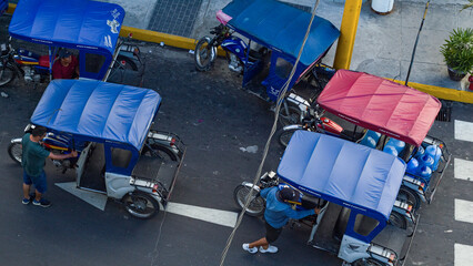 Moto taxis parked in street corner, Iquitos, Peru