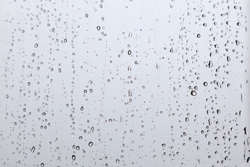 Naklejka na ściany i meble Raindrops on window background