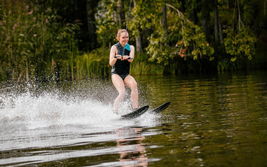 smiling woman on water skiing in life jacket