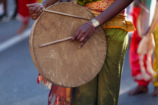 Musician playing with a malbar drum